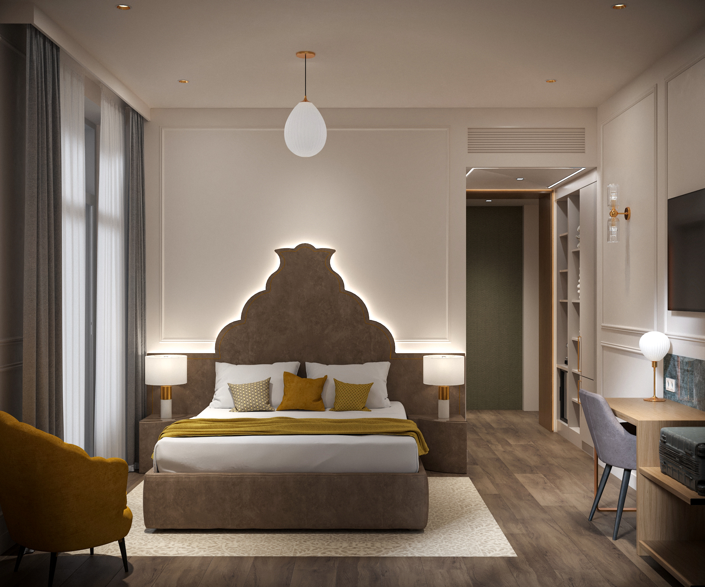 Suite with a scalloped brown leather headboard, concealed lighting, a mustard armchair and a desk
